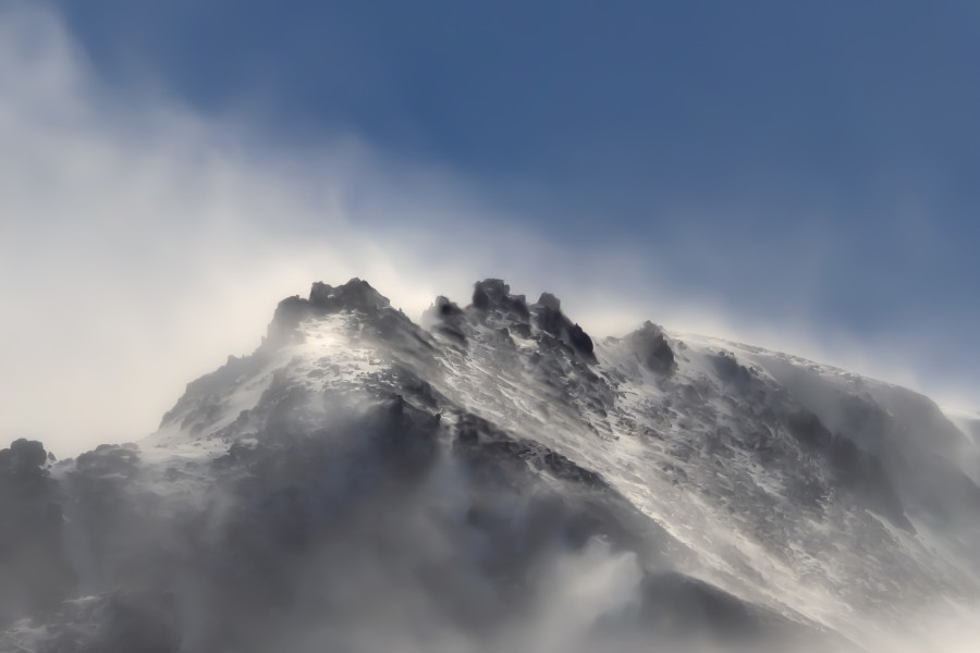 Snow blows white on the mountain tonight